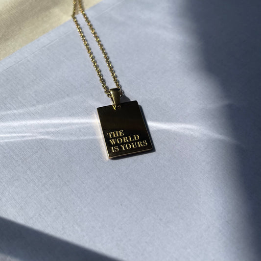 The World Is Yours Gold Pendant Necklace